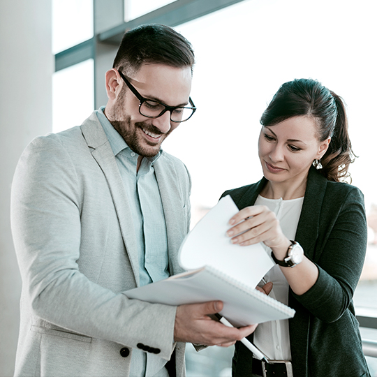 man showing papers to a woman