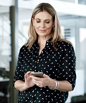woman holding her phone