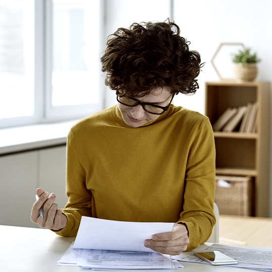 woman looking into some papers