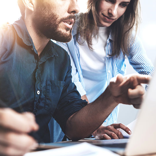 people discussing with a laptop