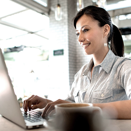 woman typing in a computer