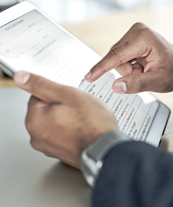 man holding his tablet