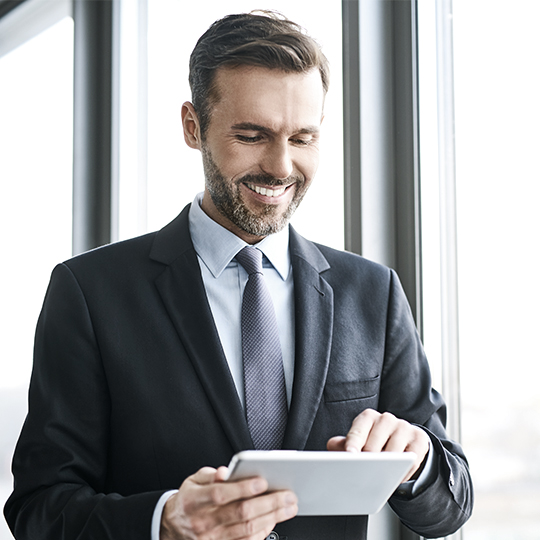 man holding his tablet