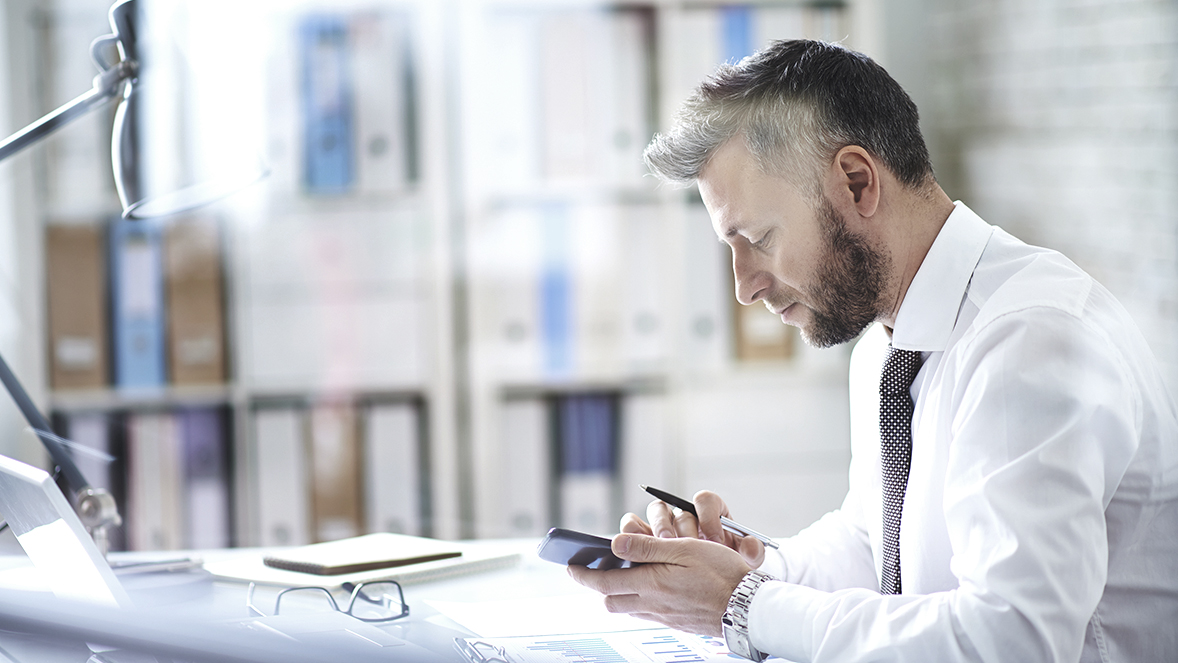 man working with his phone
