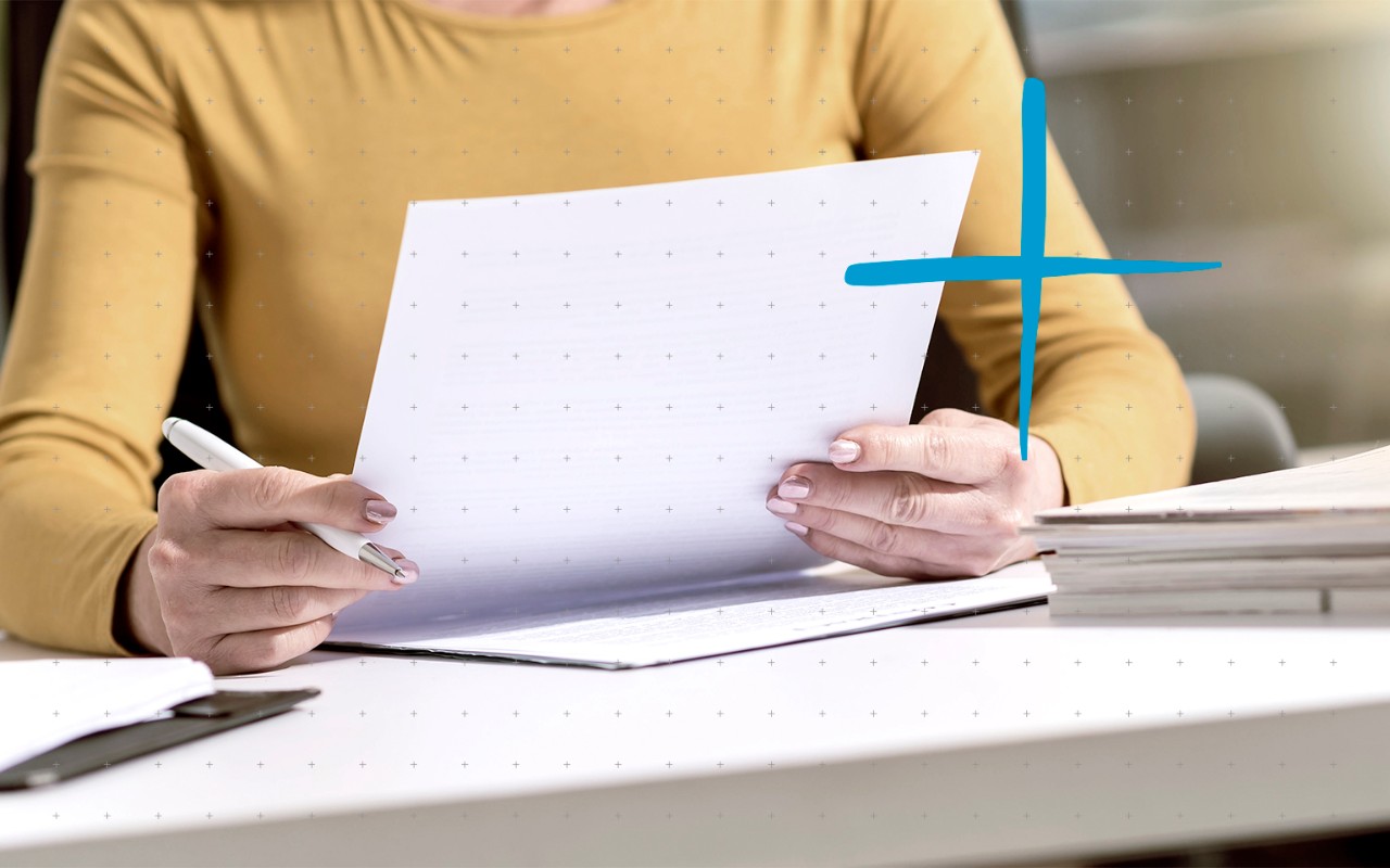 hands holding a paper