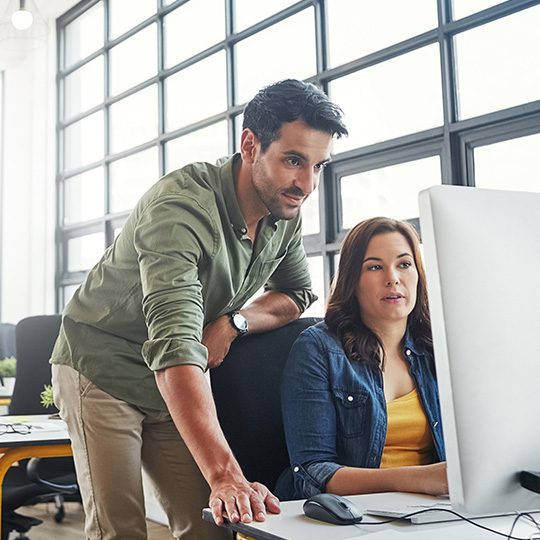 colleagues working in an open plan office