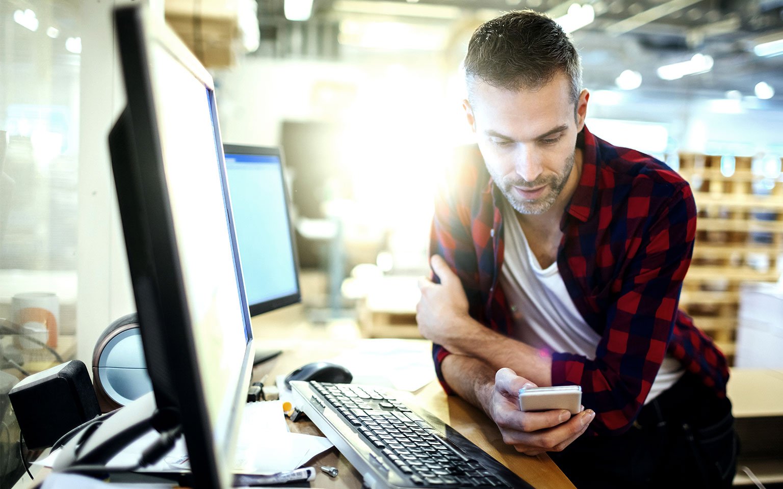 man looking at mobile phone