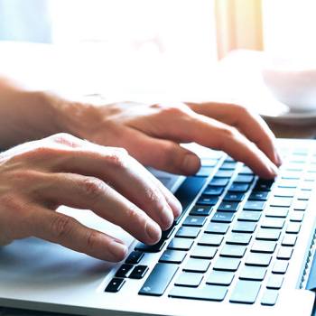 Kyocera Fleet Services Privacy Statement hands typing in a laptop