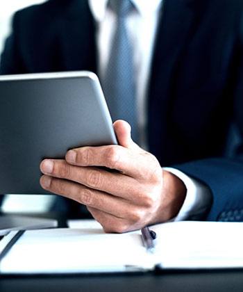The rise of remote monitoring in modern business man holding his tablet