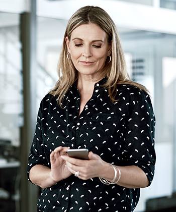 What to consider when going mobile? woman holding her phone