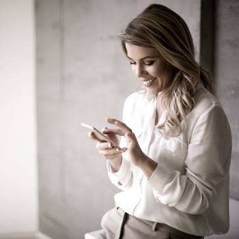 Kyocera Net Viewer woman looking into her mobile