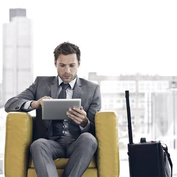 Embracing Enterprise Mobility man waiting with his tablet