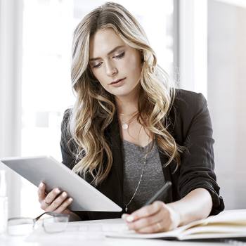 What a home working policy looks like woman looking into some papers