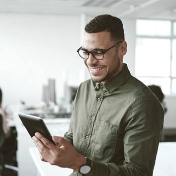 man looking into a tablet