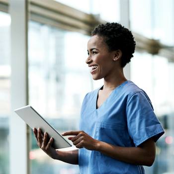 The paperless revolution in healthcare woman looking into a tablet