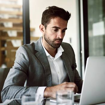 Three Documents Resisting Paperless Revolution man working with his laptop