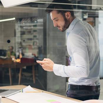 Printing and Enterprise Mobility man looking into his phone