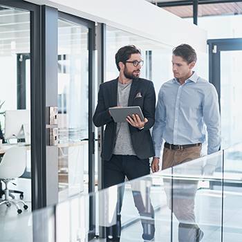 Kyocera Mobile Print people walking with a tablet